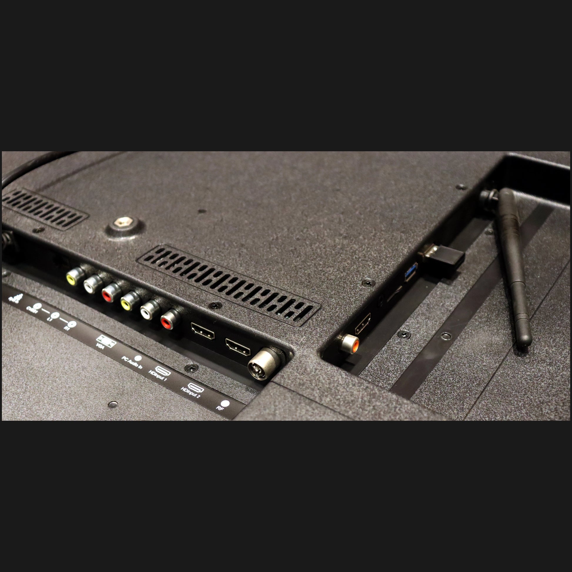 Back view of a television with connectivity ports on a black background