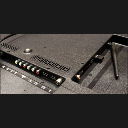 Back view of a television with connectivity ports on a black background