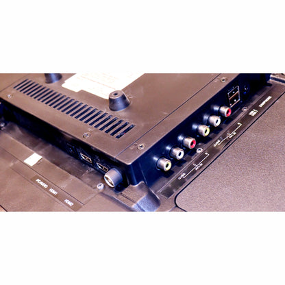 Close-up of an electronic device with connectors and labels on a white background