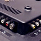 Close-up of electronic device with various ports and connectors.