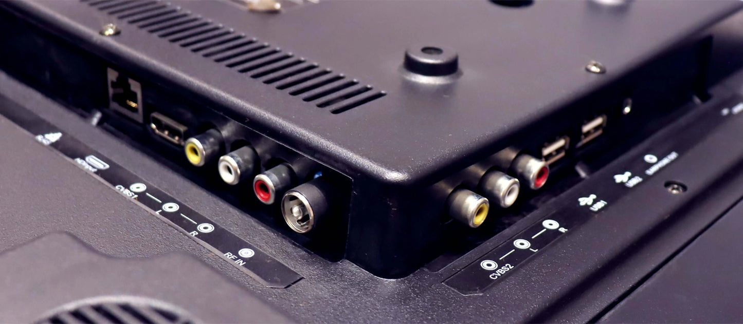 Close-up of electronic device with various ports and connectors.