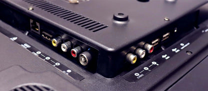 Close-up of electronic device with various ports and connectors.